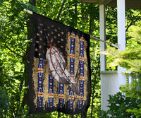 Outdoor feather flag draped on a clothesline, black with stars and blue stripe pattern