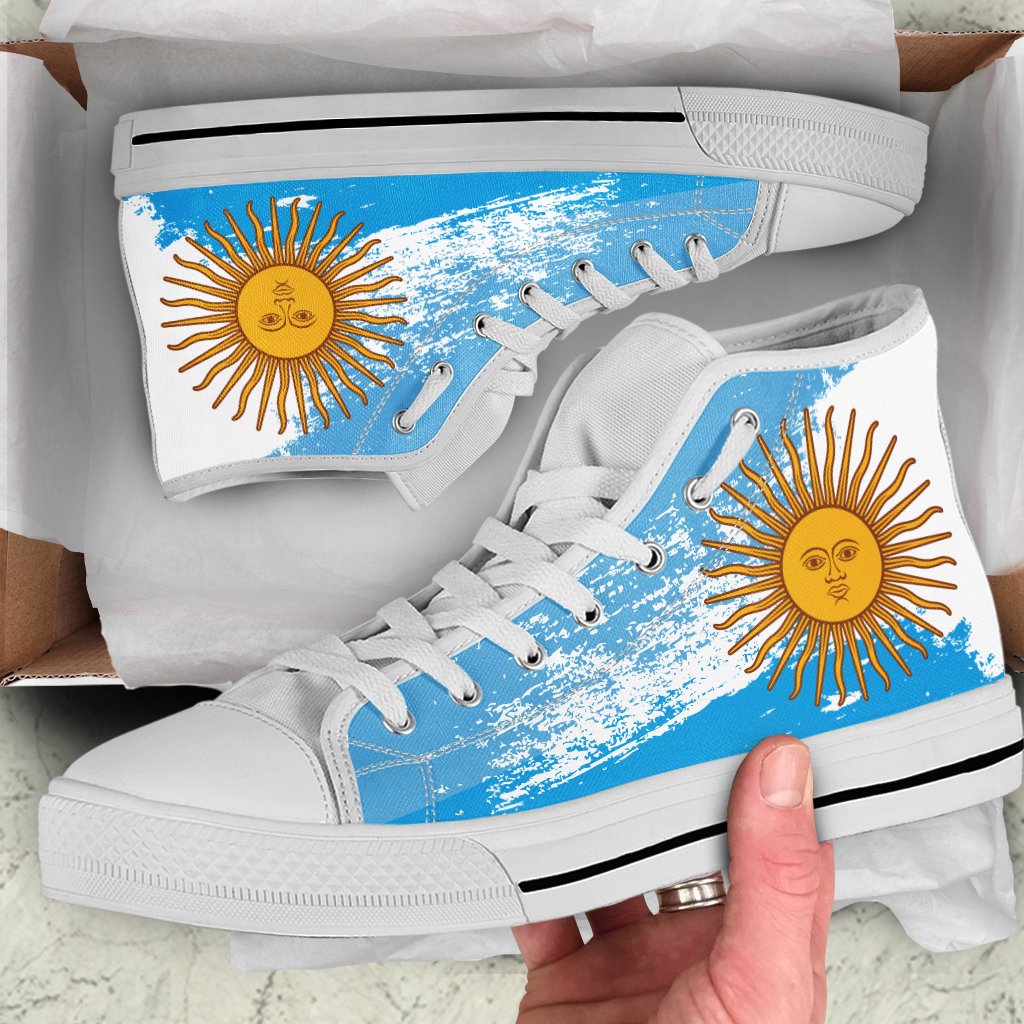 White high-top shoes with blue sun graphic, lace-up, white sole