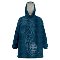 Dark teal wearable blanket hoodie with hood, long sleeves, and Hafa Adai crest graphic
