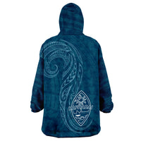 Dark teal wearable blanket hoodie with hood and large Hafa Adai crest on back