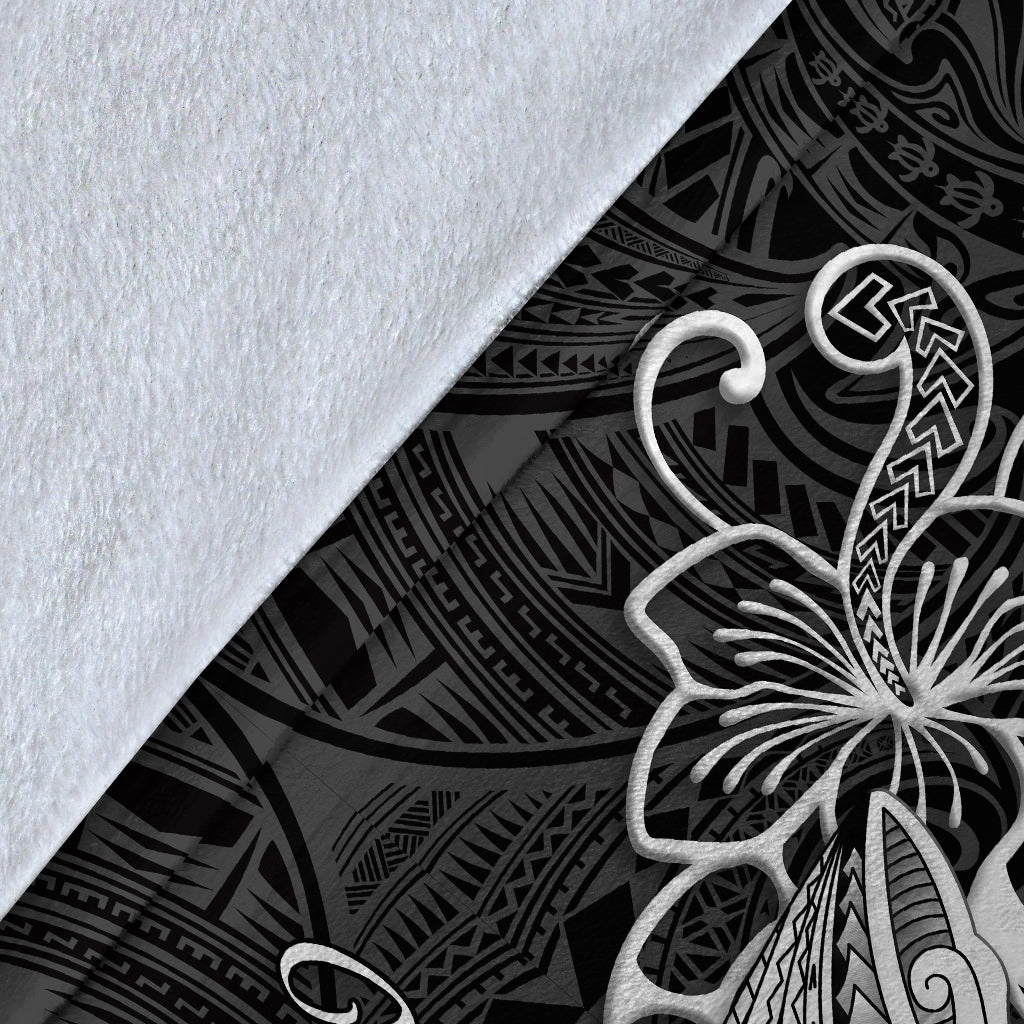 Close-up of black Polynesian shark tattoo blanket fabric with white tribal flower outline