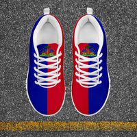 Haiti flag sneakers pair, red and blue uppers, white laces, crest on tongue, front view