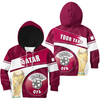 Kids maroon zip hoodie with QATAR print, QFA badge, striped sleeves, hood up