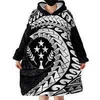 Wearable blanket hoodie on model, black and gray tribal print with hood and long sleeves