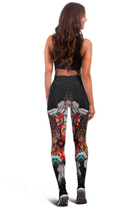 Back view of black leggings with large dreamcatcher, feather, and geometric designs.