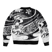 Black bomber jacket with white Polynesian tribal artwork, ribbed cuffs and knit hem.