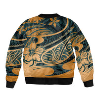 Bomber jacket back, green-and-gold tribal print with black ribbed hem and cuffs