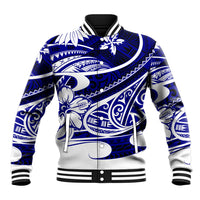 Blue baseball jacket with Polynesian-style tribal print, ribbed collar, snap front, striped hem.
