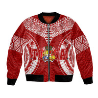 Red bomber jacket with zip front, white geometric print, and crest graphic