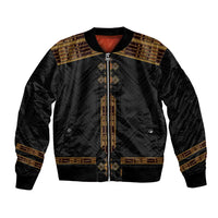 Black bomber jacket with gold geometric trim, central zipper, ribbed collar and cuffs.