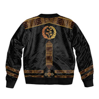 Black bomber jacket with gold emblem wreath, vertical patterned panel, ribbed hem and cuffs.
