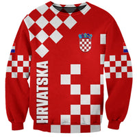 Red sweatshirt with white checkerboard pattern, crest graphic and HRVATSKA text on front.
