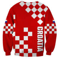Red sweatshirt with white checkerboard squares and large HRVATSKA graphic on back.