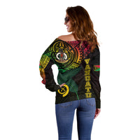 Women's off-shoulder sweater, black with large back tribal print and yellow symbols