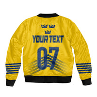 Yellow bomber jacket with blue crown icons and Your Text back graphic.