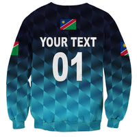 Cricket sweatshirt with geometric navy-teal print, YOUR TEXT 01 and flag on back