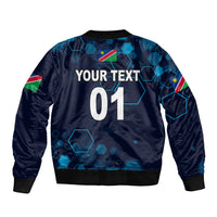 Navy cricket bomber jacket back with blue hex pattern, large text "YOUR TEXT 01"