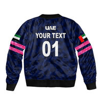 Navy bomber jacket back with large text graphic and multicolor striped sleeves