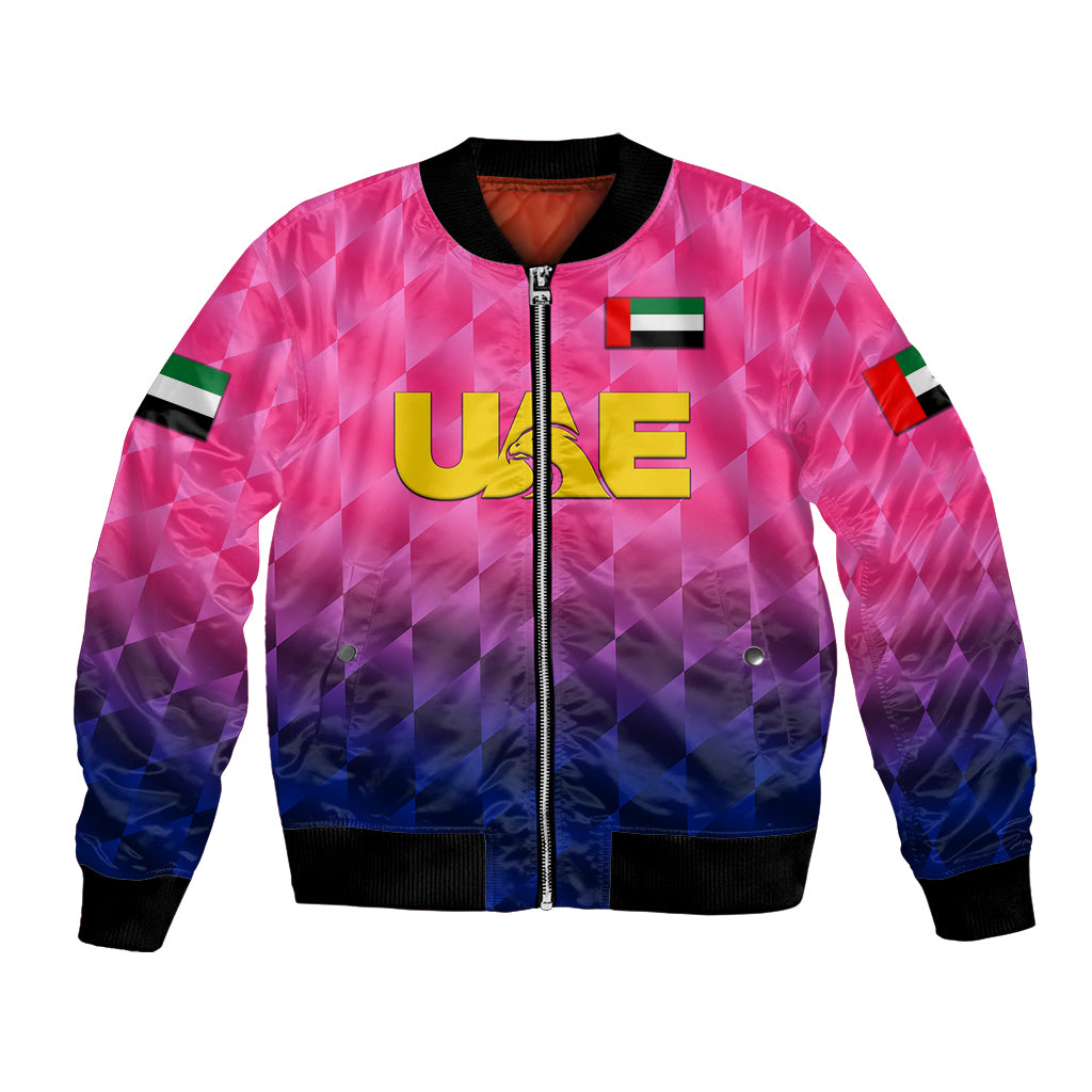 Pink cricket bomber jacket with full zip, black ribbed cuffs, UAE graphic, colorblock sleeves.