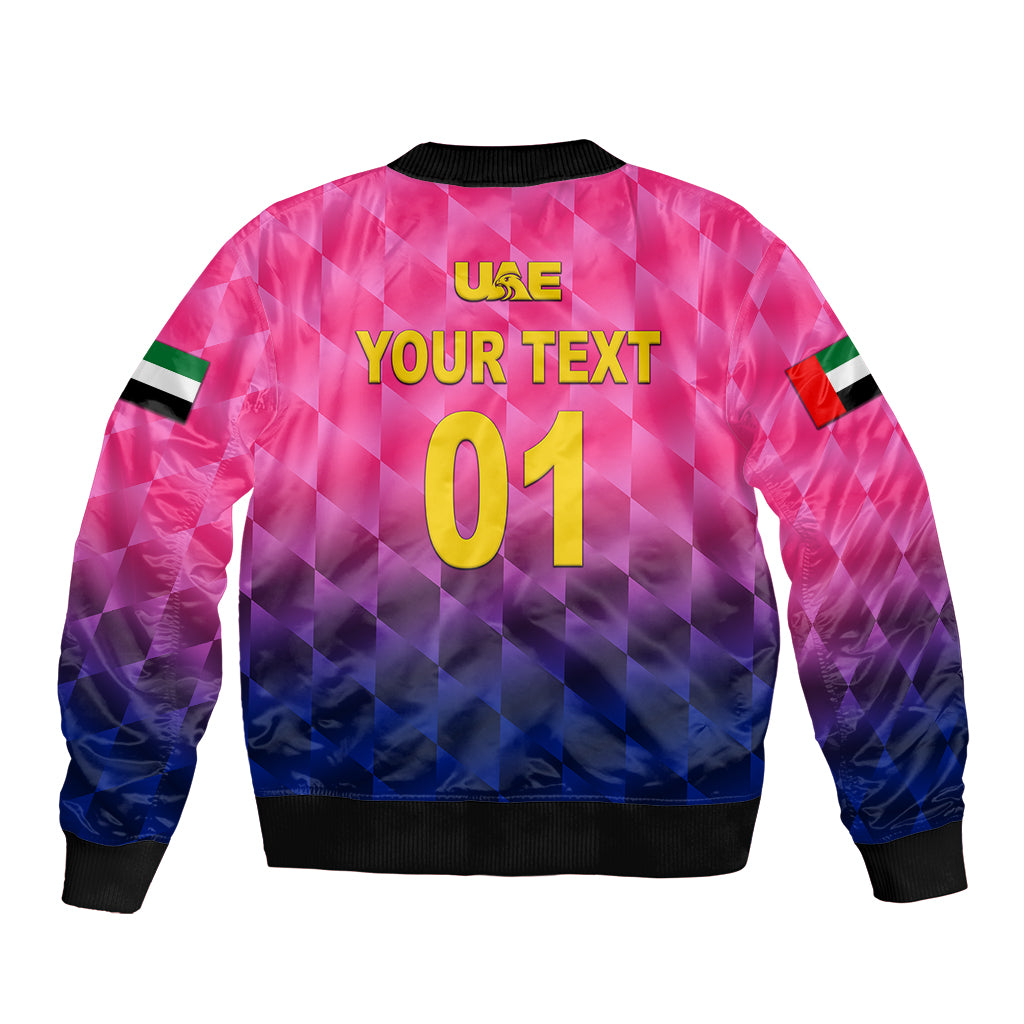 Pink cricket bomber jacket back with USA and 'YOUR TEXT 01' print, black ribbed hem.