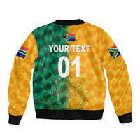 Yellow bomber jacket back with green check print, lion graphic, and '01' text