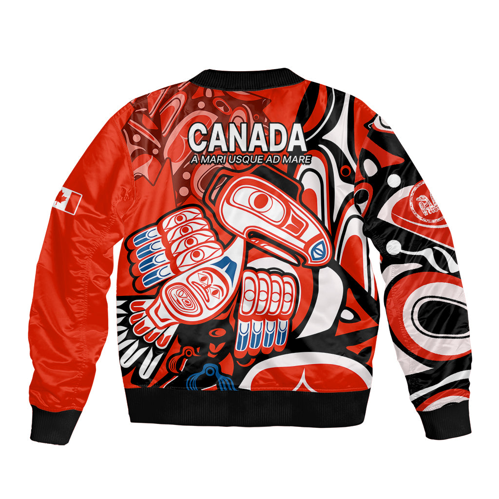 Red bomber jacket with ribbed hem and back graphic with CANADA text and raven