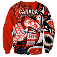 Unisex red sweatshirt with CANADA text and raven-style artwork, crew neckline