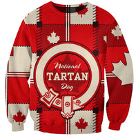Red sweatshirt with tartan plaid graphic, maple leaf and National Tartan Day logo