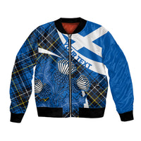 Blue bomber jacket with zip front, black ribbed trim, tartan and thistle print