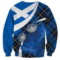 Blue tartan sweatshirt with large thistle graphic and white diagonal saltire panel