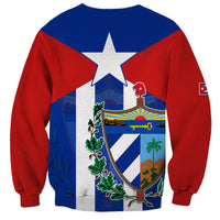 Blue and red sweatshirt with coat of arms crest, white star, and small sleeve flag patch