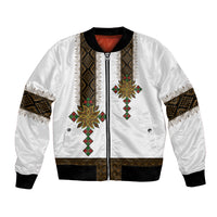 White bomber jacket with front zipper, ribbed trim, and African patterned center panels