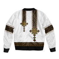 White bomber jacket back with African cross motif, ribbed hem and cuffs