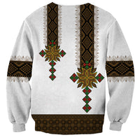 White unisex sweatshirt with vertical geometric print and sun cross motif, ribbed hem