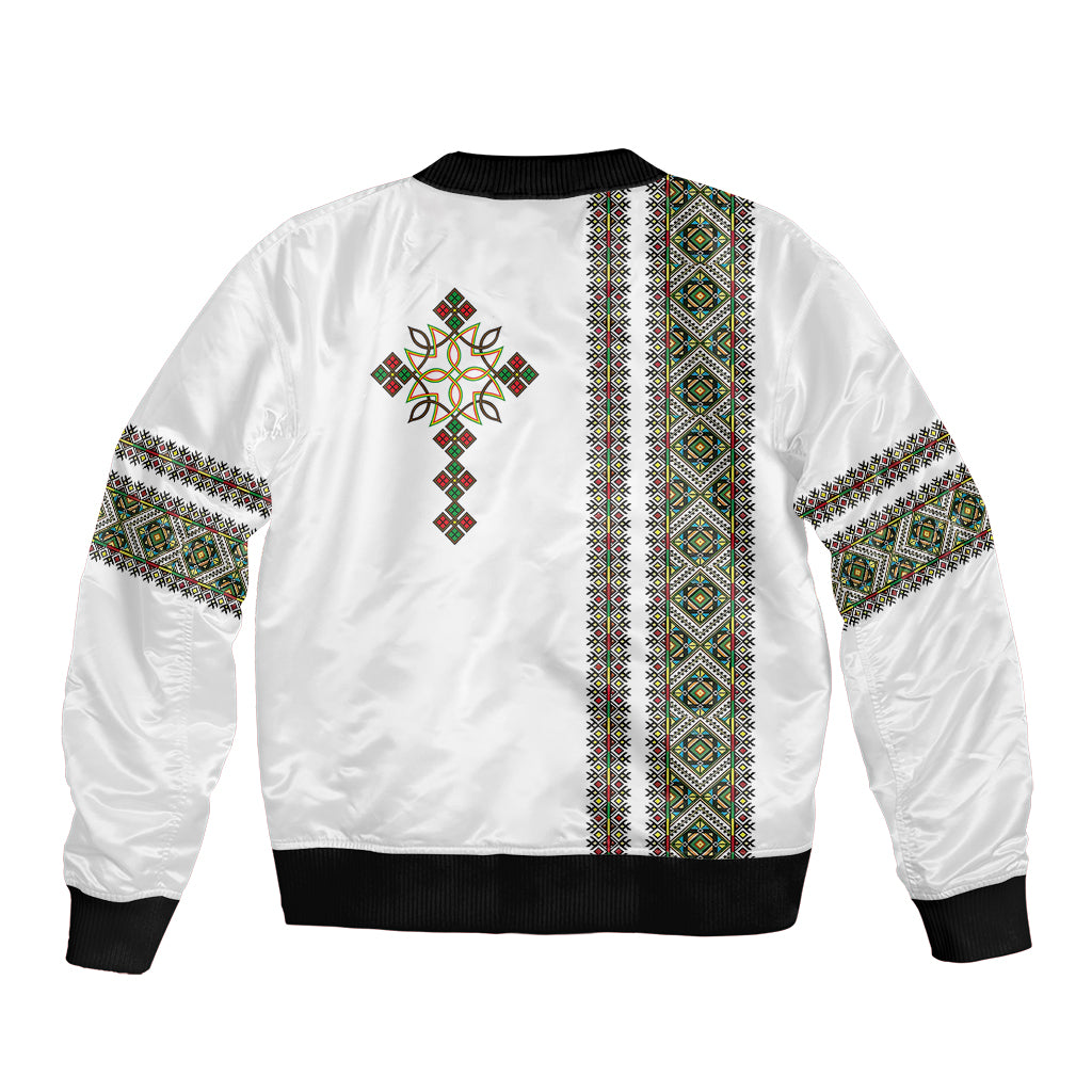 White bomber jacket back with vertical patterned stripe, cross motif, and black ribbed hem