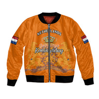 Orange bomber jacket with black ribbed collar, zip front, flag sleeve patches, front graphic