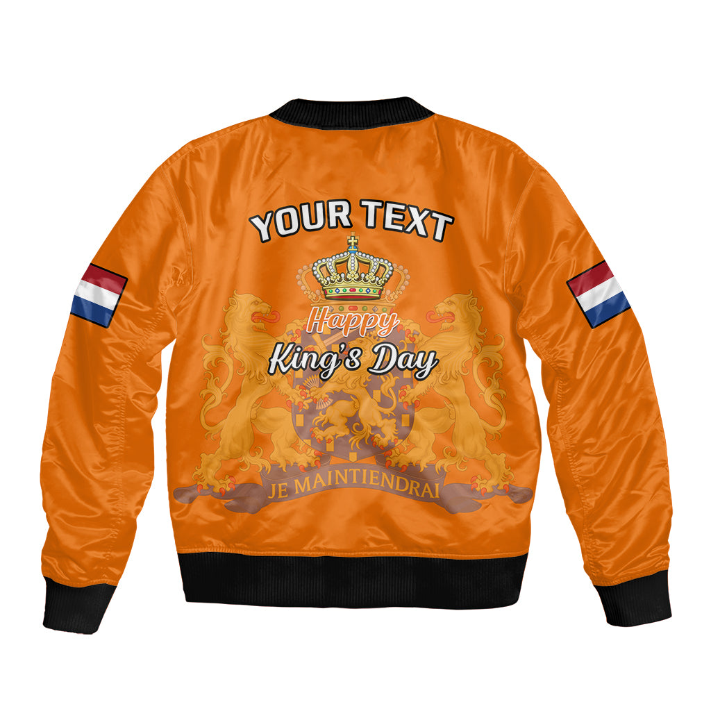 Orange bomber jacket with black ribbed hem and cuffs, back crown graphic with Happy King’s Day text
