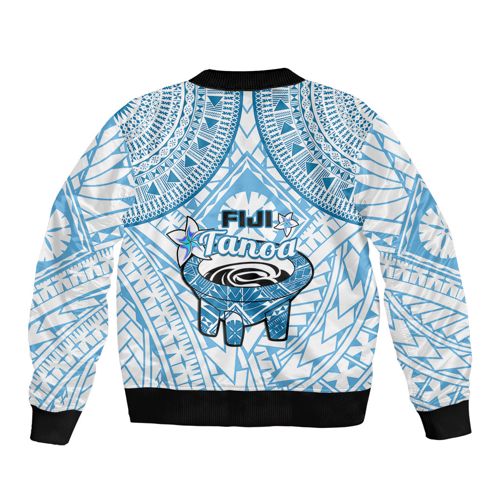 Blue and white bomber jacket with back logo graphic, geometric pattern, black ribbed cuffs.