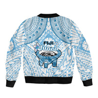 Blue and white bomber jacket with back logo graphic, geometric pattern, black ribbed cuffs.
