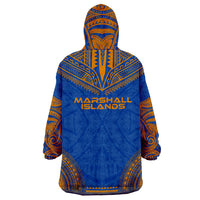 Blue wearable blanket hoodie, back view with tribal patterns and yellow “Marshall Islands” text