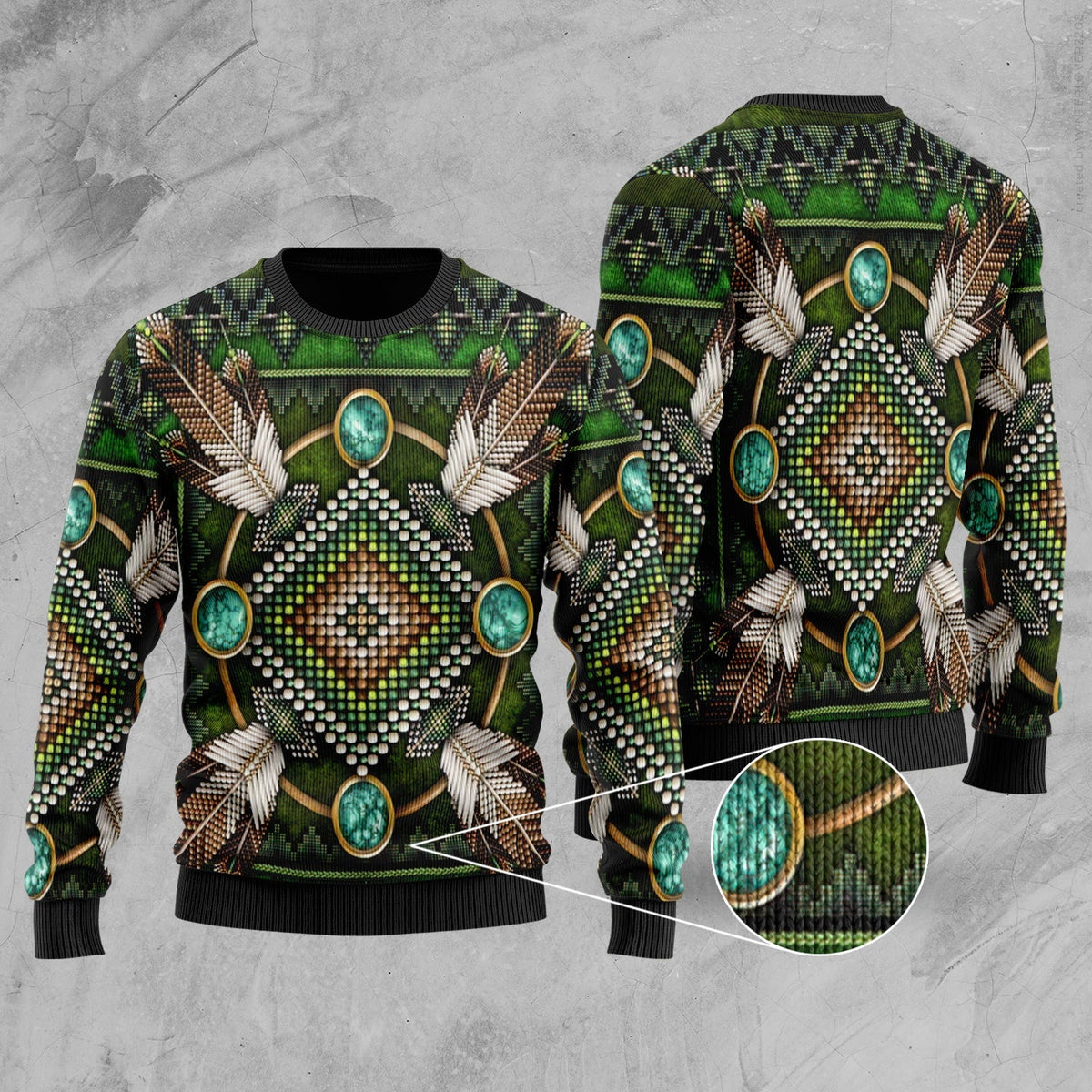 Green multicolor native-style sweater with geometric beadwork and feather graphic; ribbed cuffs