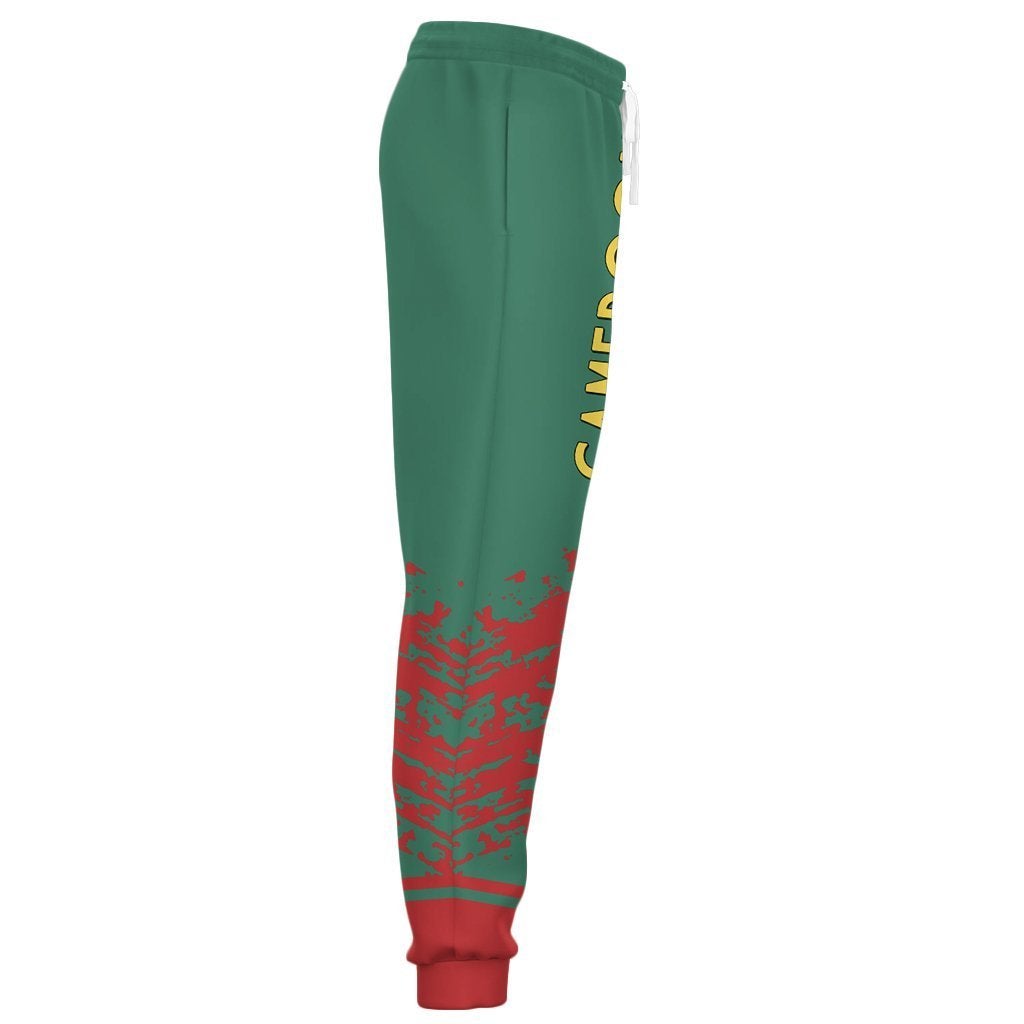 Green jogger pants side view with red camo print on lower legs and red ribbed cuffs