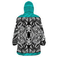 Wearable blanket hoodie back with turquoise hood, black-and-white tribal print, turquoise hem