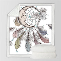 White dreamcatcher print blanket with teal beads and gray/purple feathers, shown folded flat