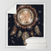Black dreamcatcher galaxy throw blanket with gold feathers, folded with soft white backing