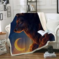 Wolf and night moon throw blanket in dark blue, tan, and orange on a couch