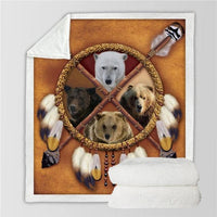 Animal dreamcatcher blanket with white, dark and tan animal faces in a circular ring