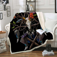 Tribal skull and dreamcatcher feather throw blanket, multicolor feathers, draped on sofa