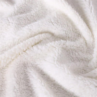 White sherpa hooded blanket fabric close-up showing curly pile texture