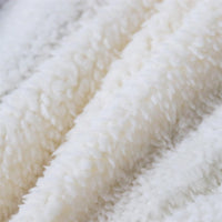 Thick white teddy sherpa blanket fabric with soft, fuzzy surface